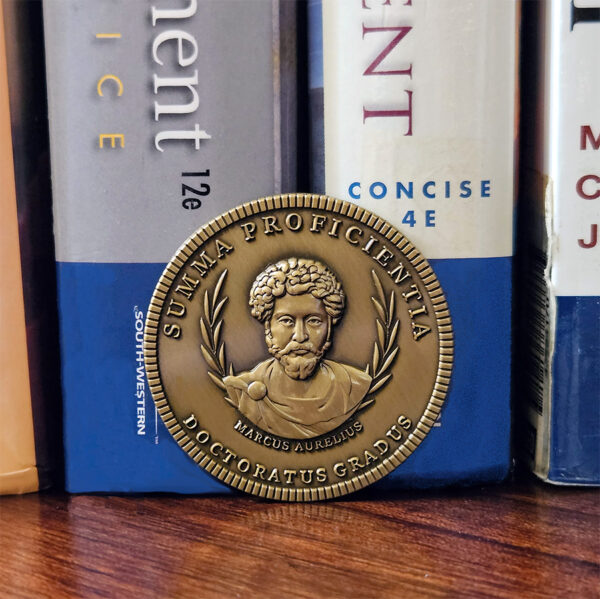 Doctorum's PhD Coin is remarkable tribute and an exceptional gift for the PhD in your life. Whether celebrating a new PhD program graduate or honoring the seasoned Doctor, this unique creation is sure to make a lasting impression.